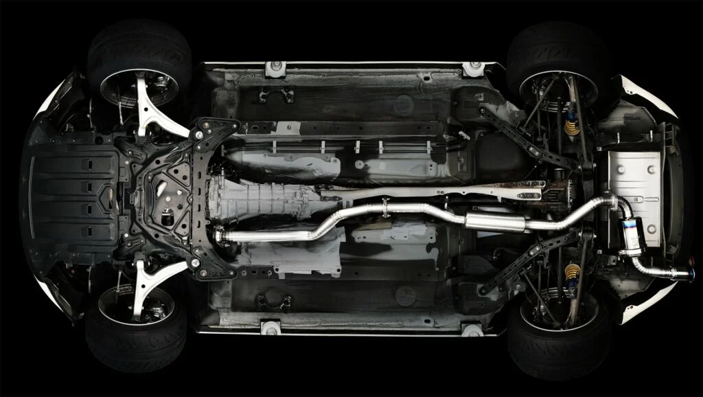 Underside of Mazda Miata with aftermarket exhaust system installed