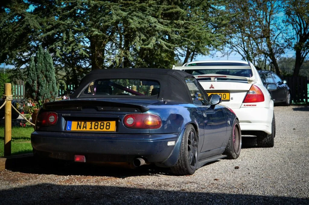 Street driven Mazda MX-5 with a roll bar