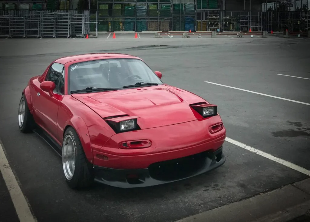 Tuned Mazda Miata with exterior upgrades like converted headlights