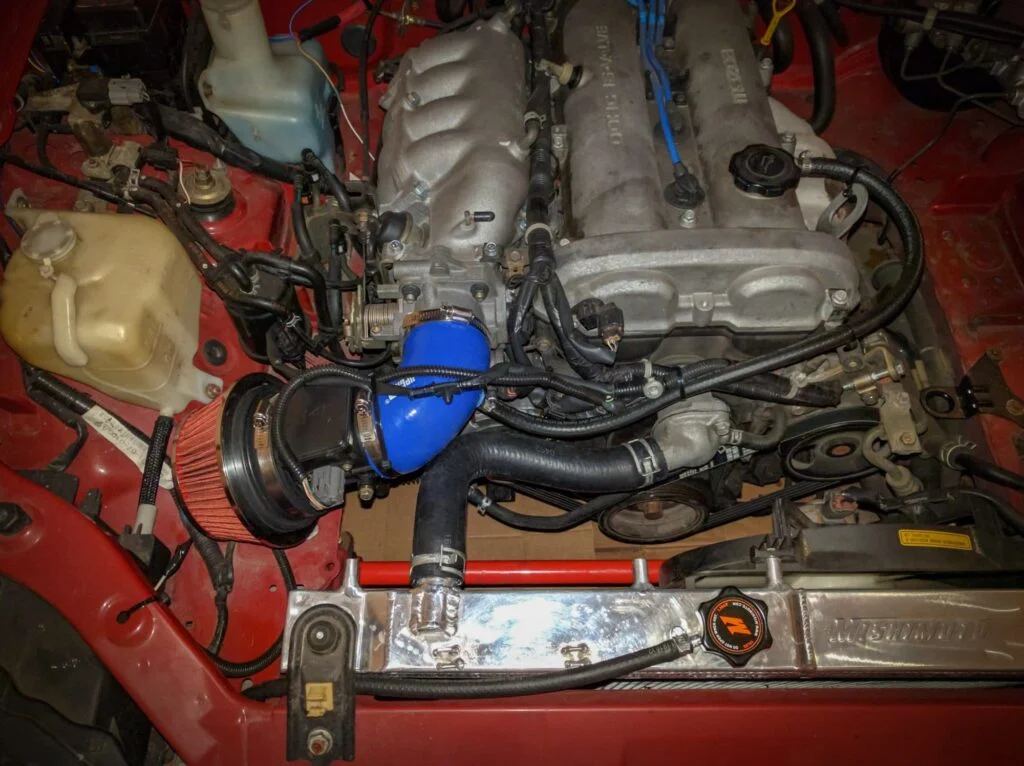 A Miata ram air intake like this is unlikely to provide any power gains, though it will sound better than factory