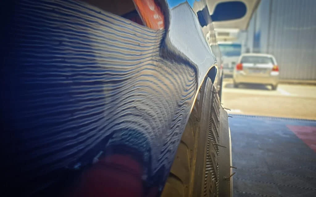 A pulled, pumped and flared rear fender