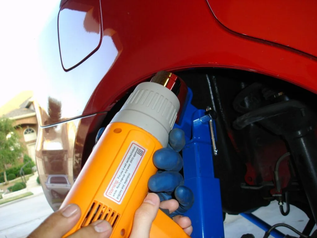 Use a heat gun on the fenders before rolling them
