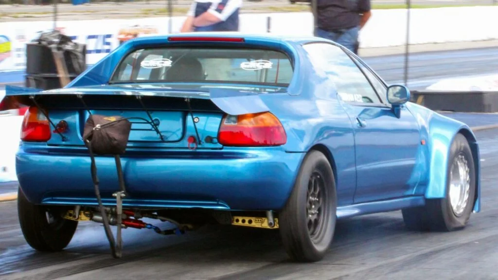 Front wheel drive drag car with a staggered wheel setup.