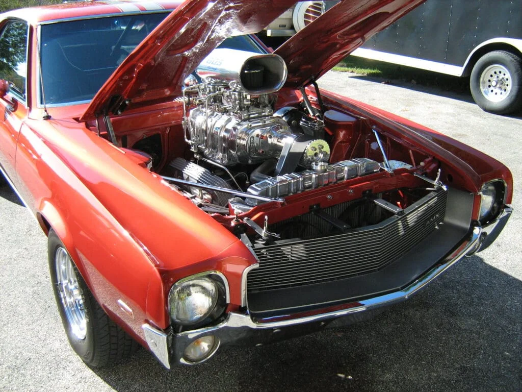 Blown 1968 AMX with a hole cut in the hood