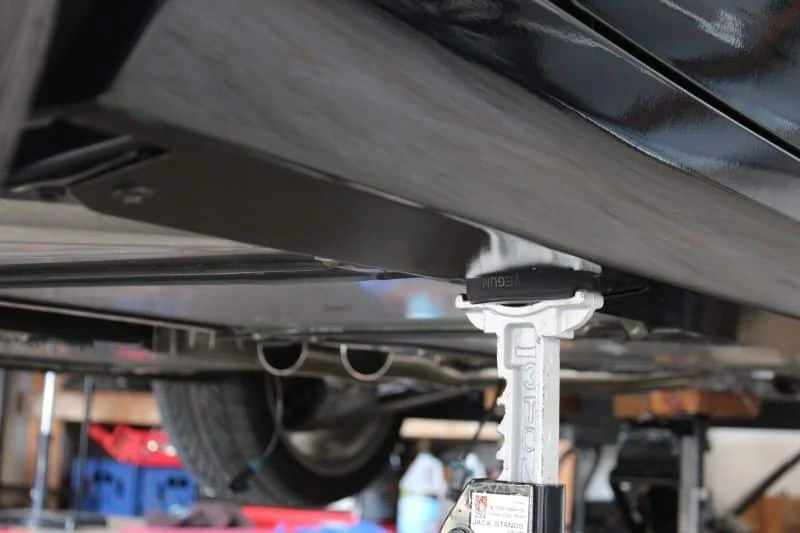A car on a car jack stand