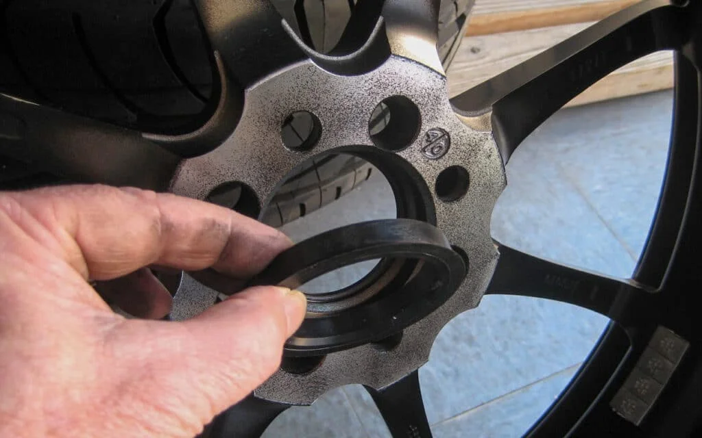 An aftermarket wheel with a plastic wheel centering ring