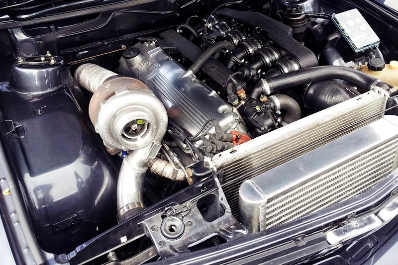 Exposed turbocharger in a modified BMW's engine bay