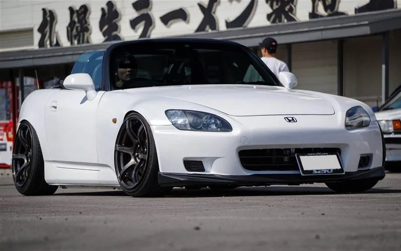 Black Gram Lights 57C6 aggressive wheel fitment on a white Honda S2000