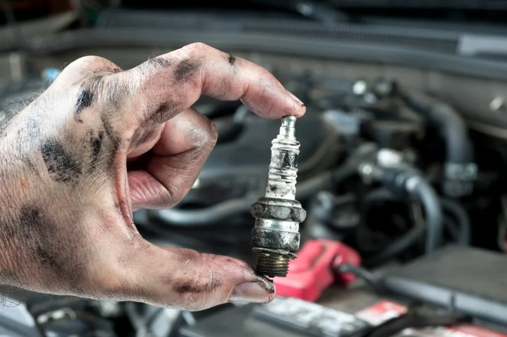 Greasy hands from changing a spark plug