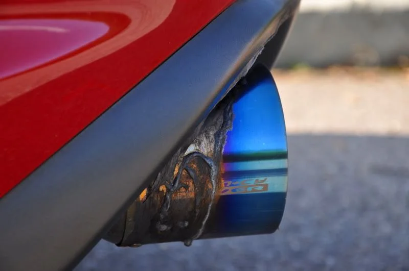 Agency Power exhaust melted Mazda RX8 rear bumper exhaust shroud