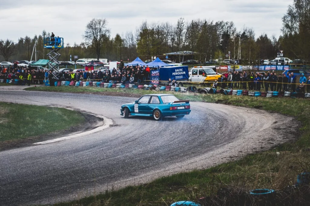 Car drifting into a sharp turn at a race track