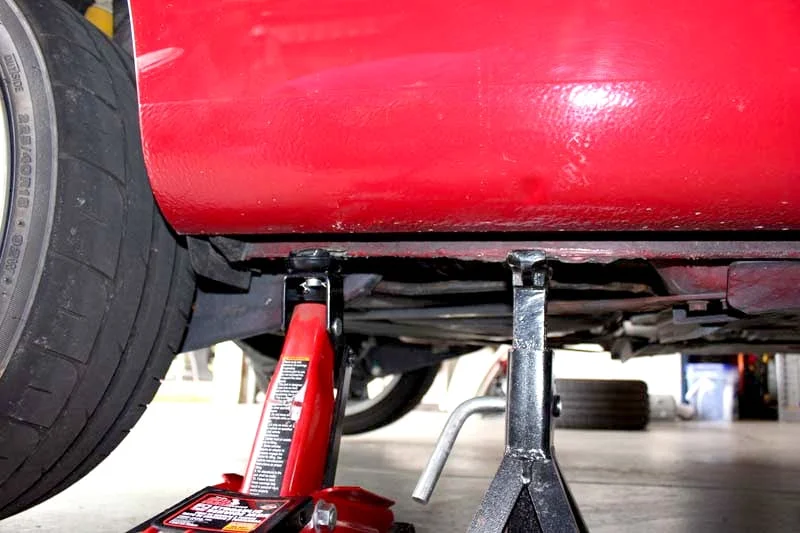 Car raised on a floor jack