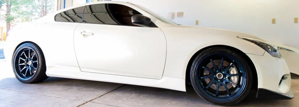 Matte blue Volk CE28N wheels on a white G37 coupe