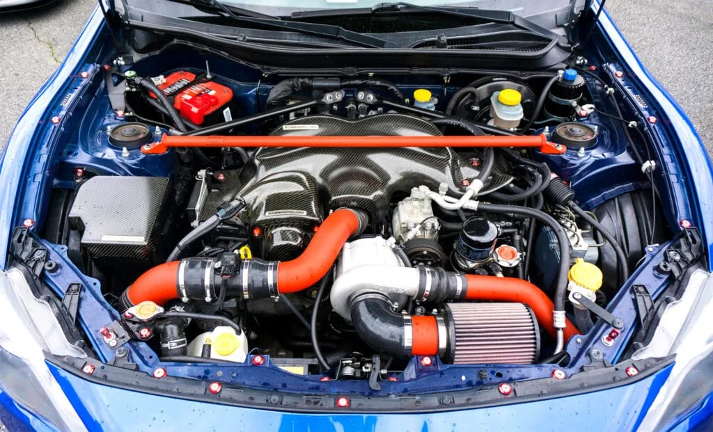 Jackson Racing supercharger installed on a blue Scion FRS