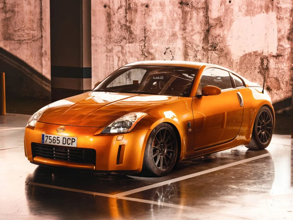Orange Z33 in a parking lot