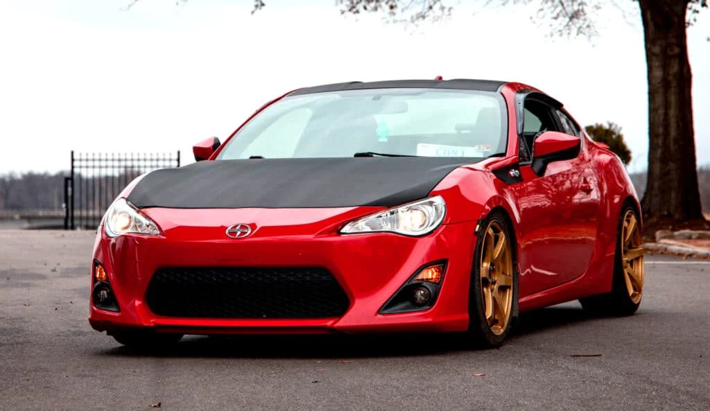 Red Scion FRS with gold rims