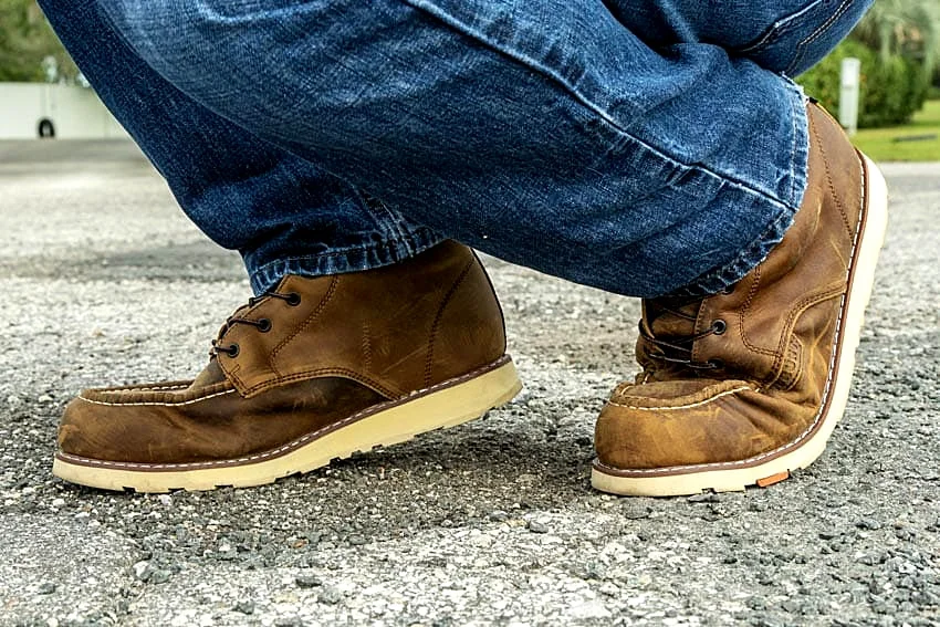 A man flexing his work boots