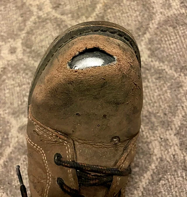 Work boot steel toe cap damage