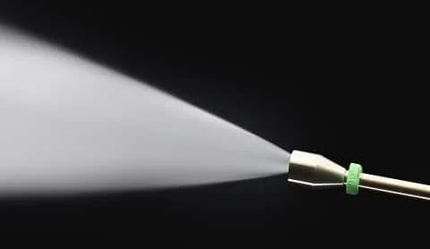 Water gushing out of pressure washer nozzle