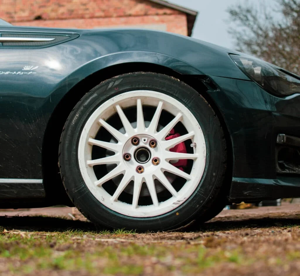 British racing green BRZ with white rims