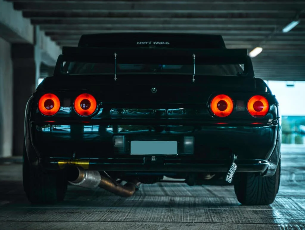 A clean R32 Nissan Skyline GT-R with a single exit catback exhaust