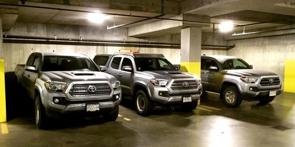 Different model year Toyota Tacomas parked alongside each other