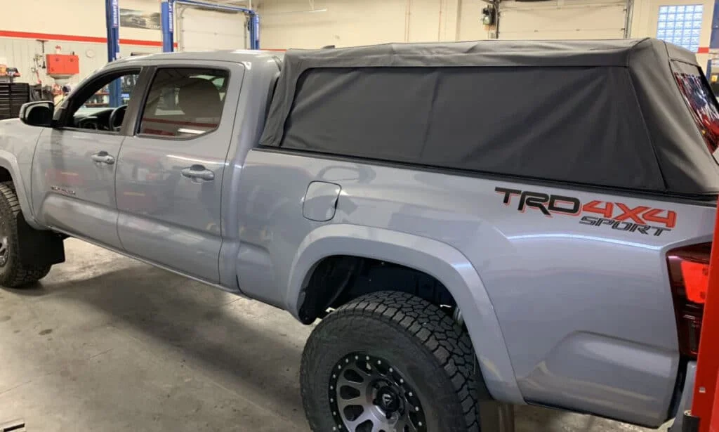 Bestop SuperTop camper shell installed on a Tacoma