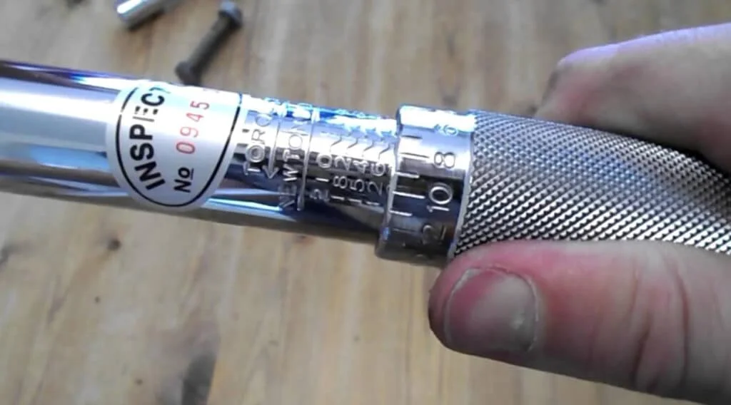Torque wrench in mechanic's hand