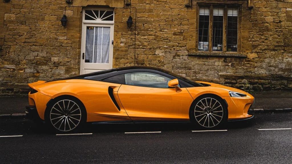 Yellow McLaren GT parked on an empty street
