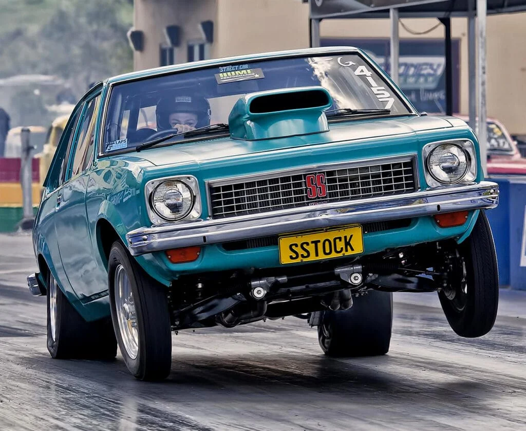 Stroked drag car launching off the start line