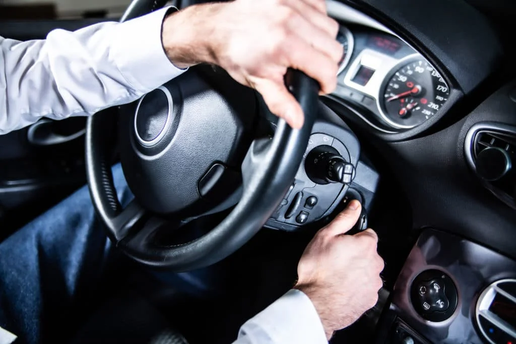 Person starting a car