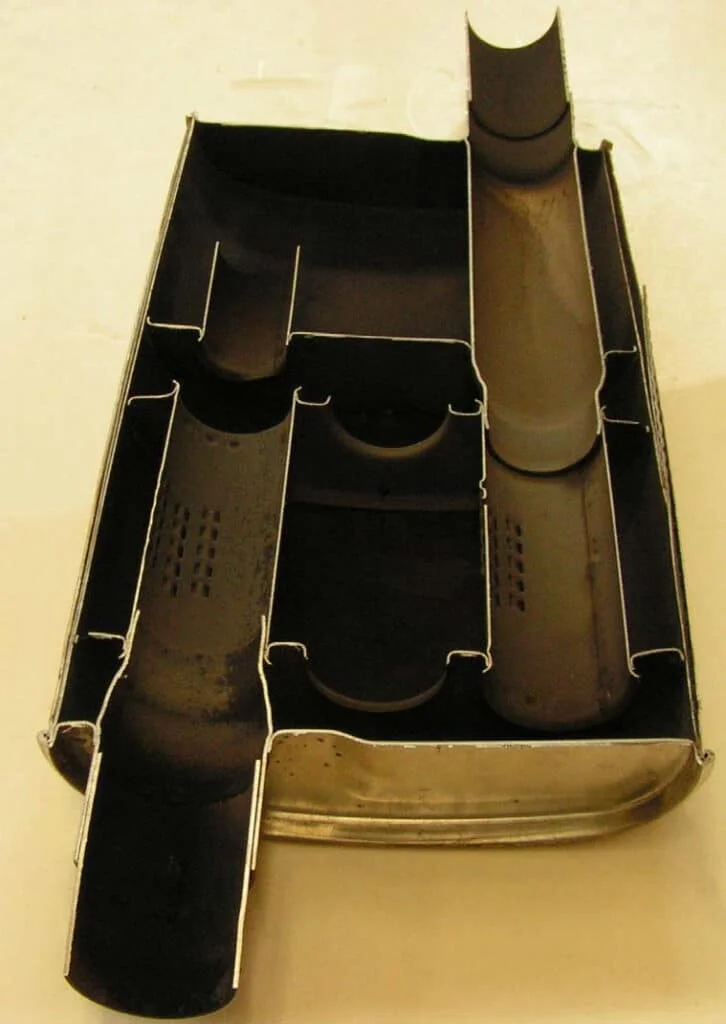 A cut open exhaust muffler