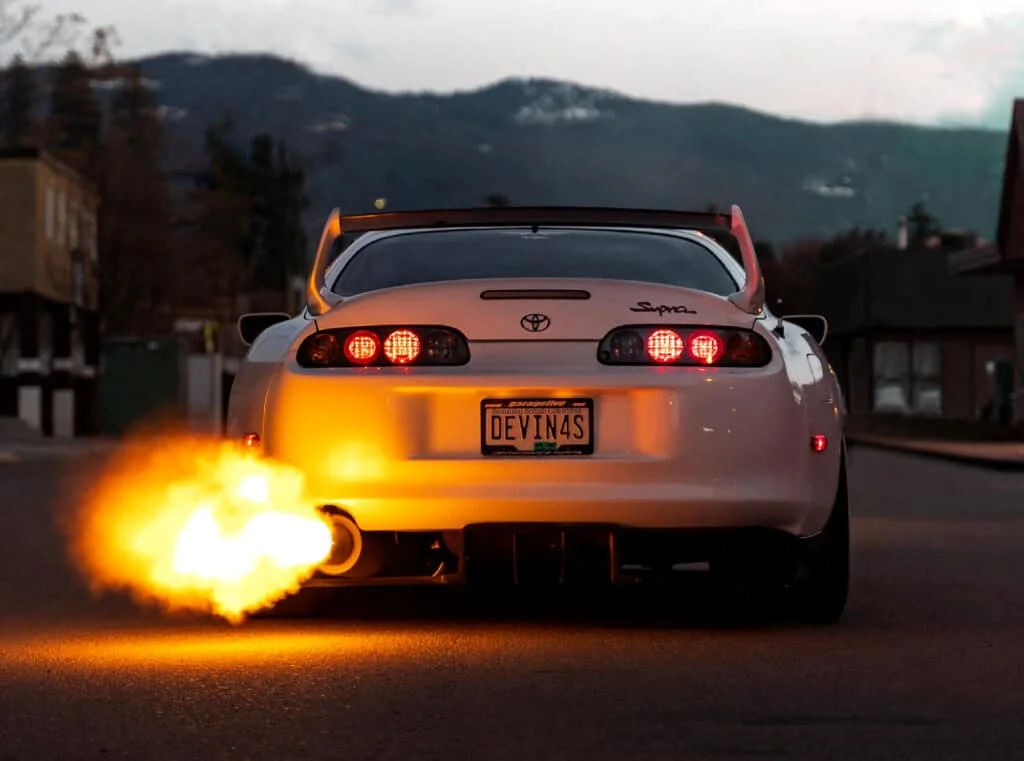 White Supra spitting flames