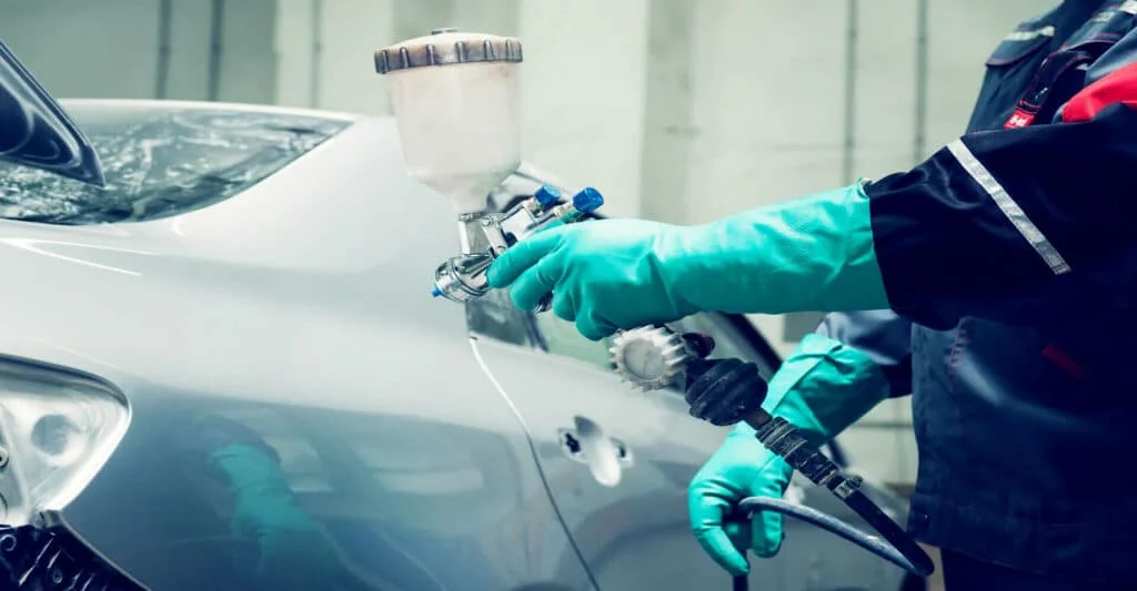 Professional repainting a car