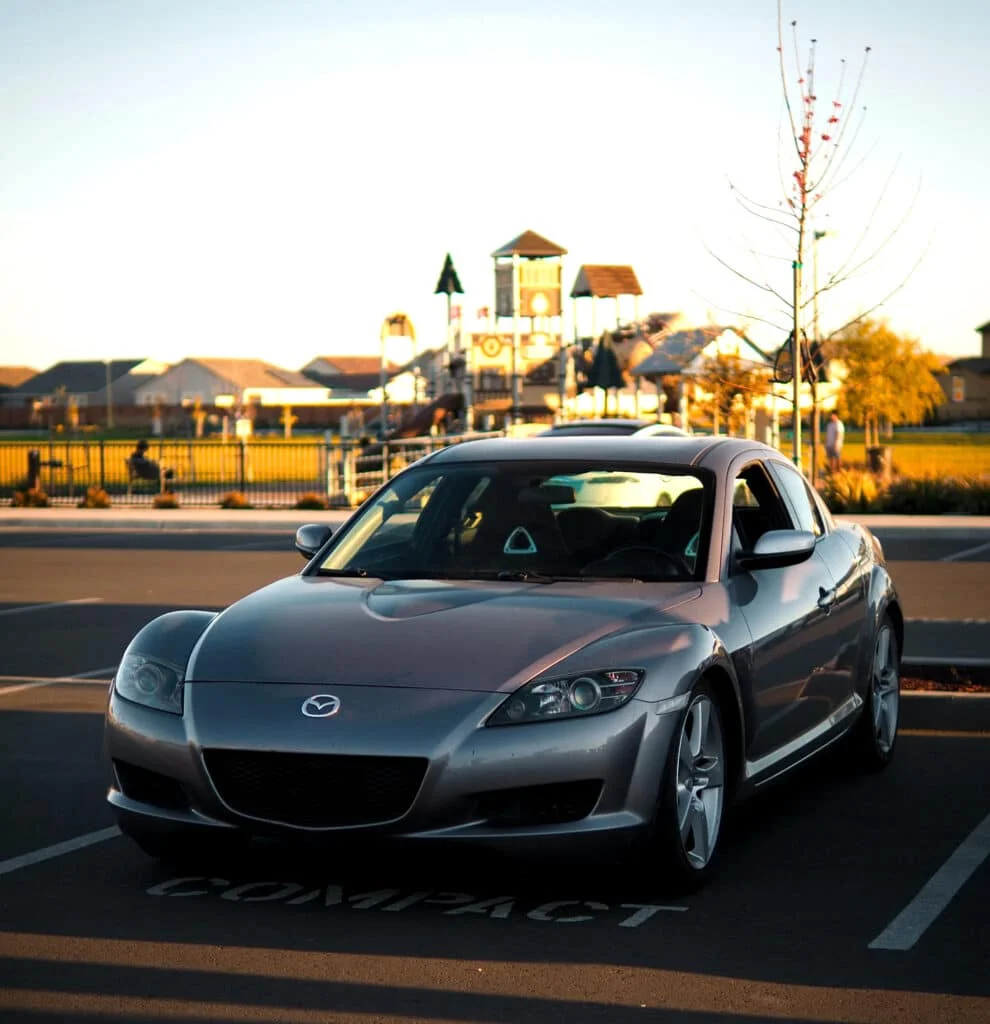 Grey RX8 during sunset