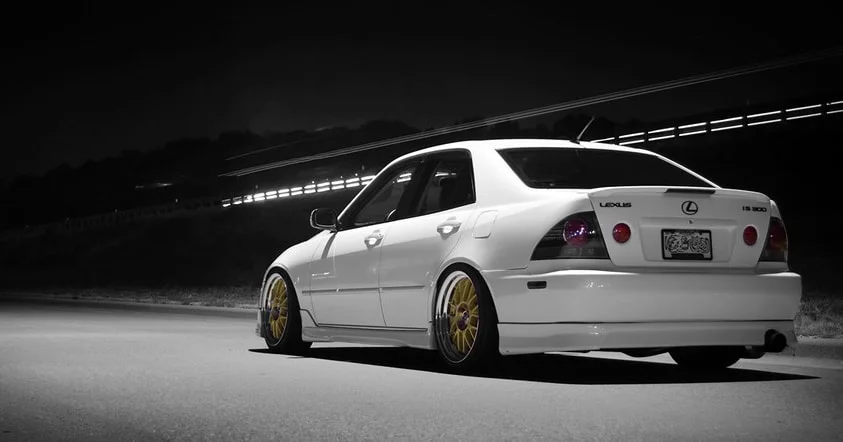 Tail end of a white IS300 with gold rims