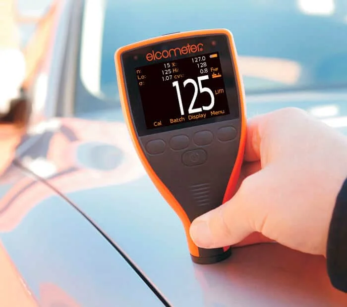 Paint thickness gauge in use