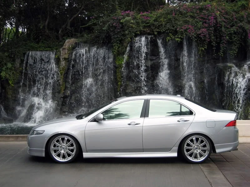 A grey sedan with reflective tint