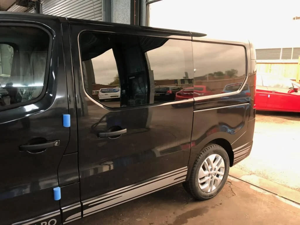 A black van with dark window tint