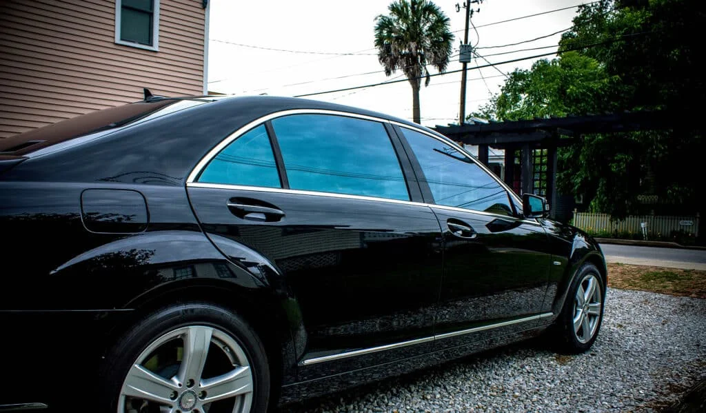 Blue reflective window tint on a sedan