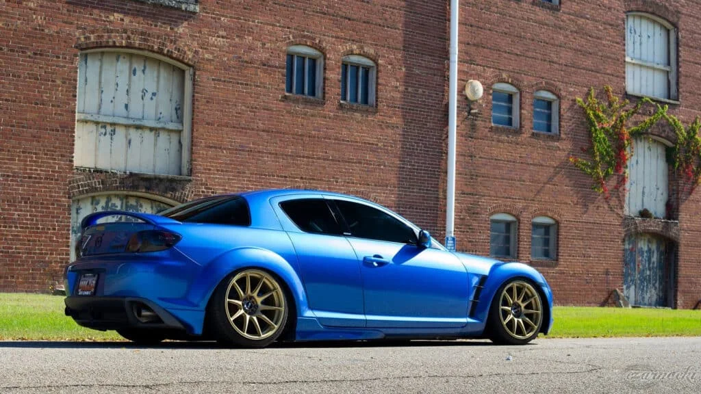 Blue Mazda RX8 lowered on gold rims