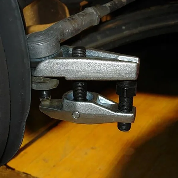 Using a ball joint seperator tool