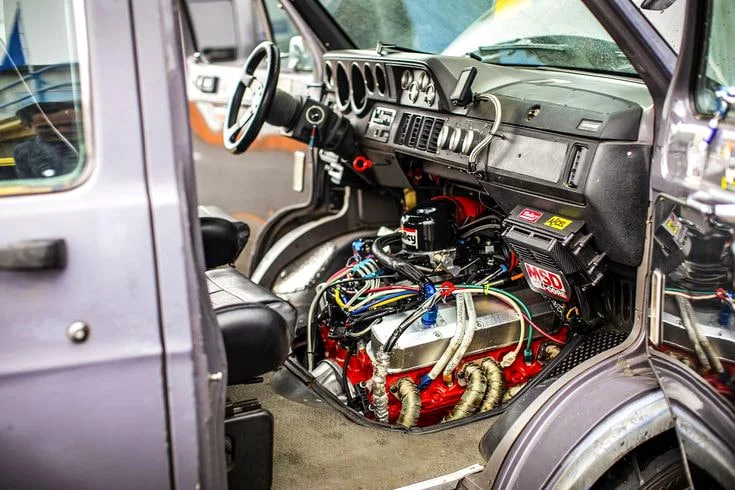 Dajuban van interior with protruding engine