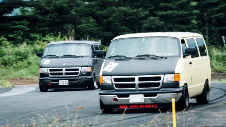 Dajban vans head to head on a race track