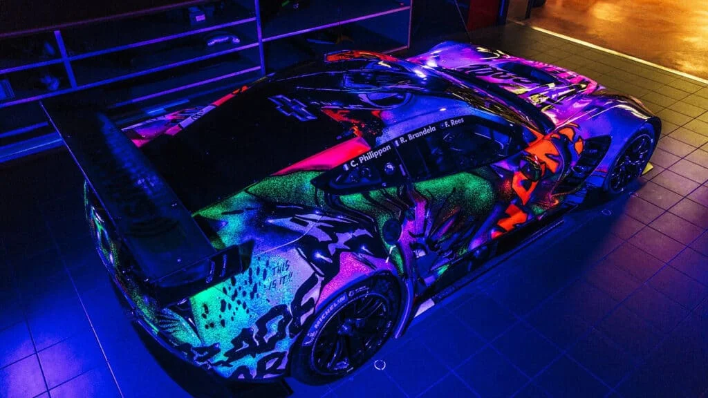 Glowing graffiti on a Corvette