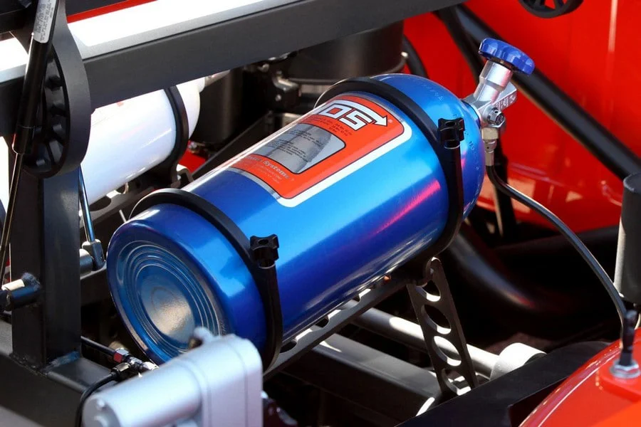 Large NOS cylinder hooked on to a car