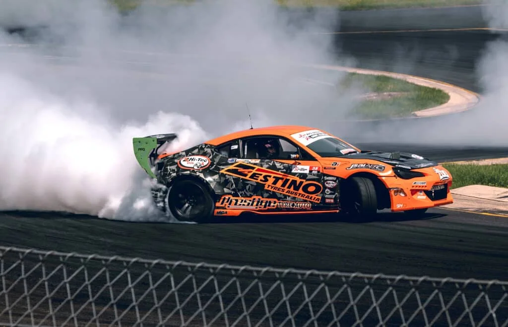 Orange BRZ drifting