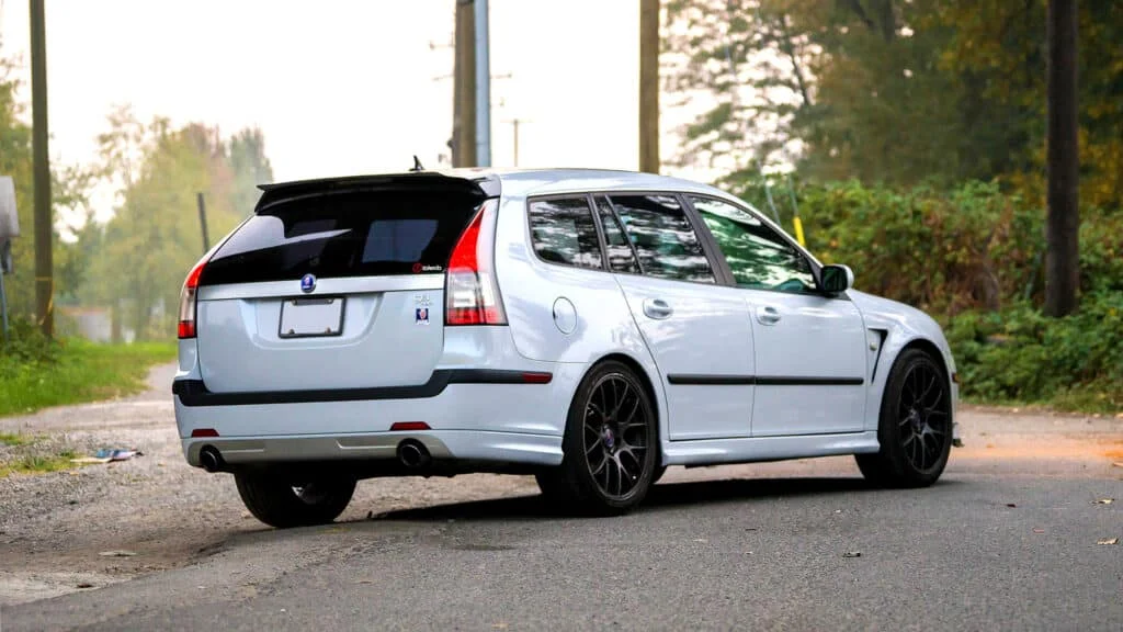 A white Saab 9-3 wagon