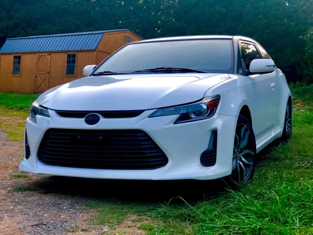 White Scion tC with a blacked-out logo