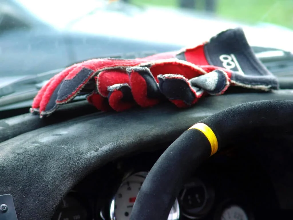 Externally stitched Sparco gloves on Alcantara dashboard